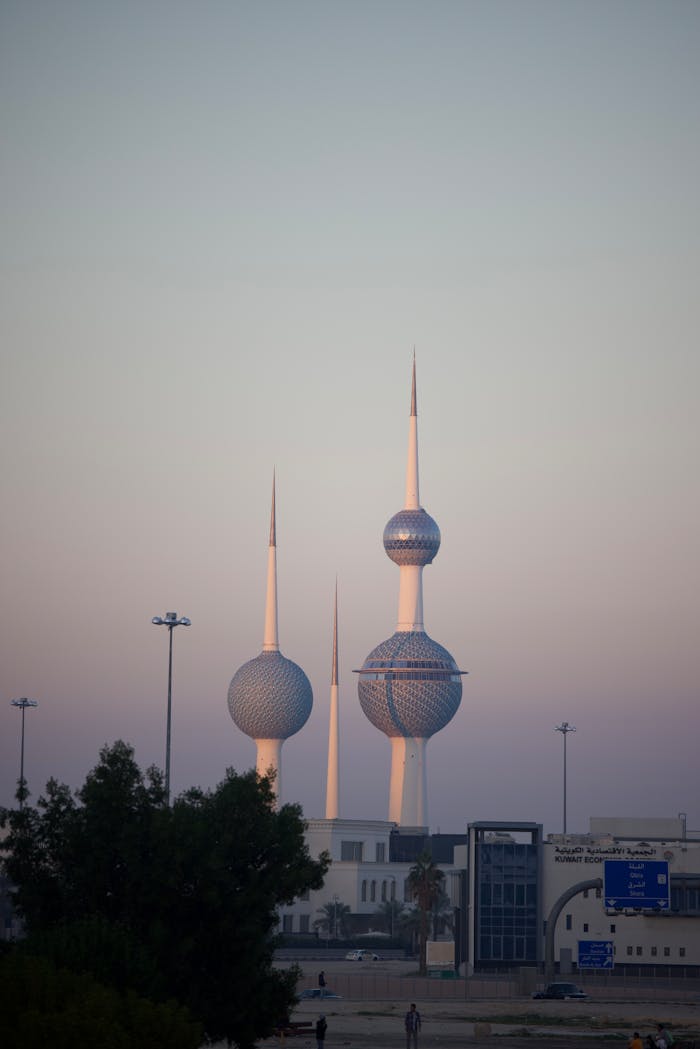 Majestic view of Kuwait Towers against a twilight sky showcasing modern architecture.